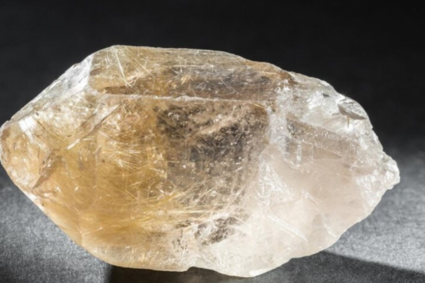 Golden rutilated quartz crystal with needle-like inclusions in clear quartz, symbolizing clarity, healing, and energy